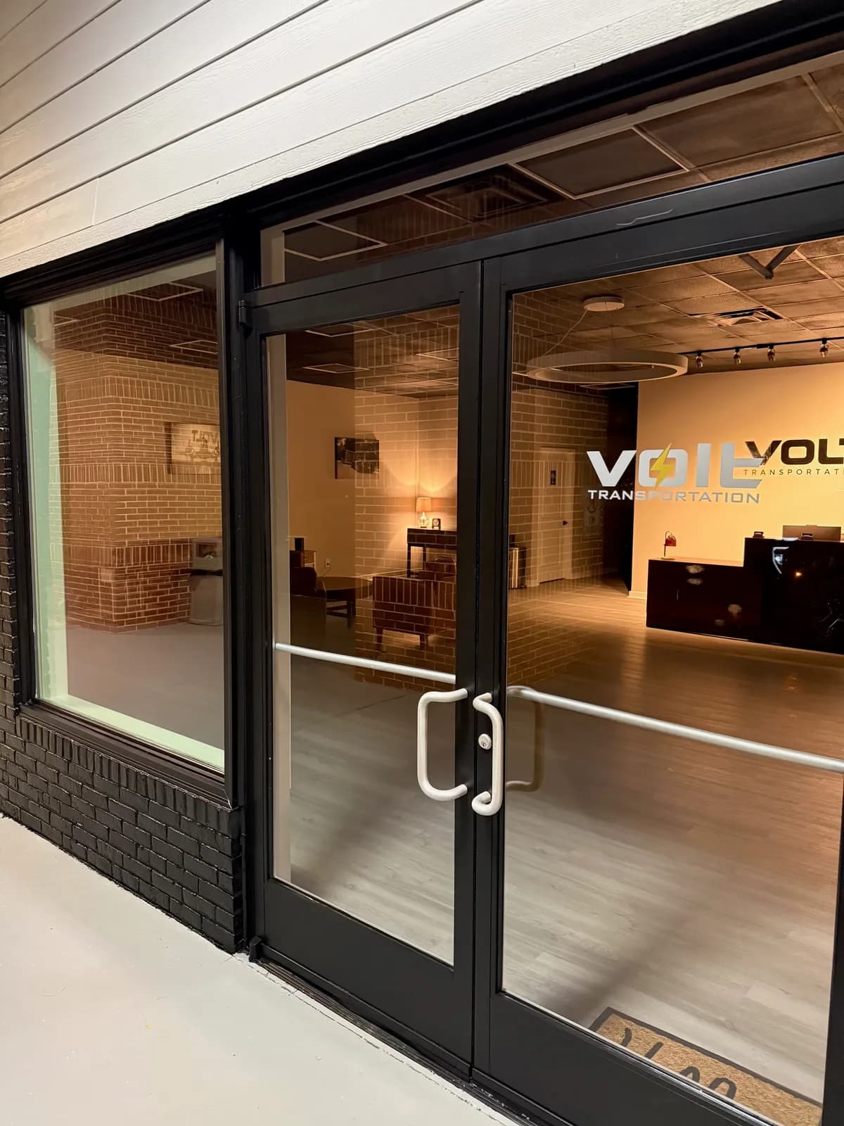 Glass entrance doors to the Volt Transportation lobby in Columbus, Georgia