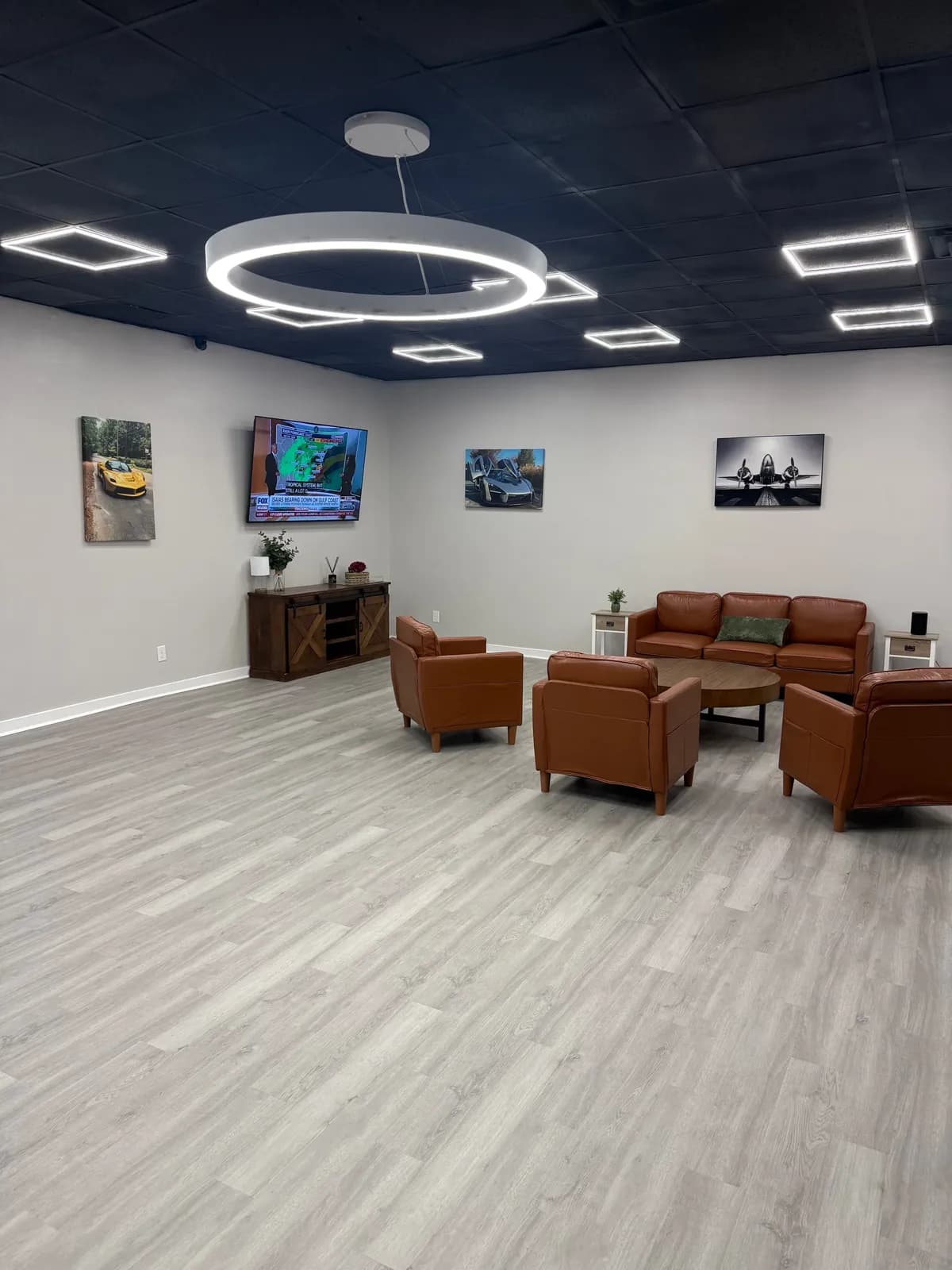 Volt Transportation passenger lounge with leather seating and a TV